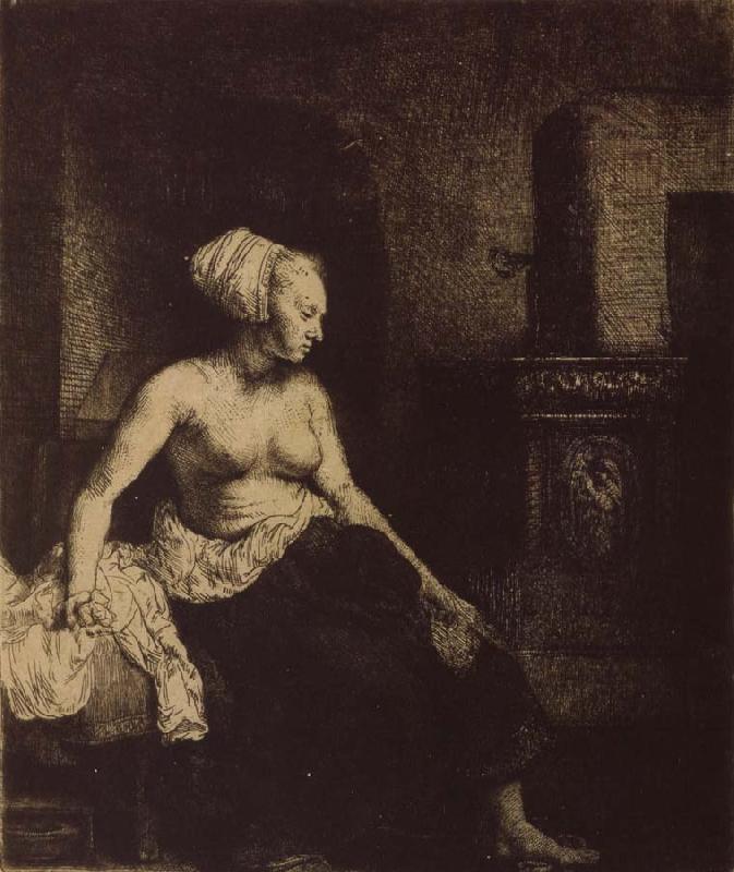 REMBRANDT Harmenszoon van Rijn Woman sitting Half-Dressed beside a Stove oil painting image